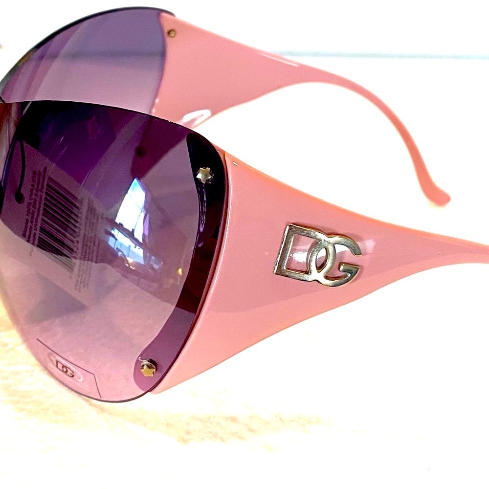 DG0707 pink frame black wraparound style lens.  Adult size